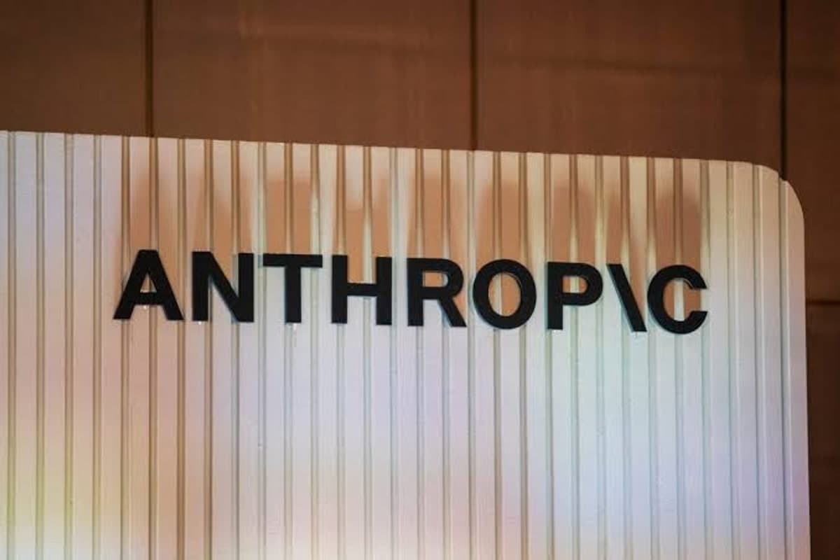 Anthropic logo on a white fluted panel at an industry event