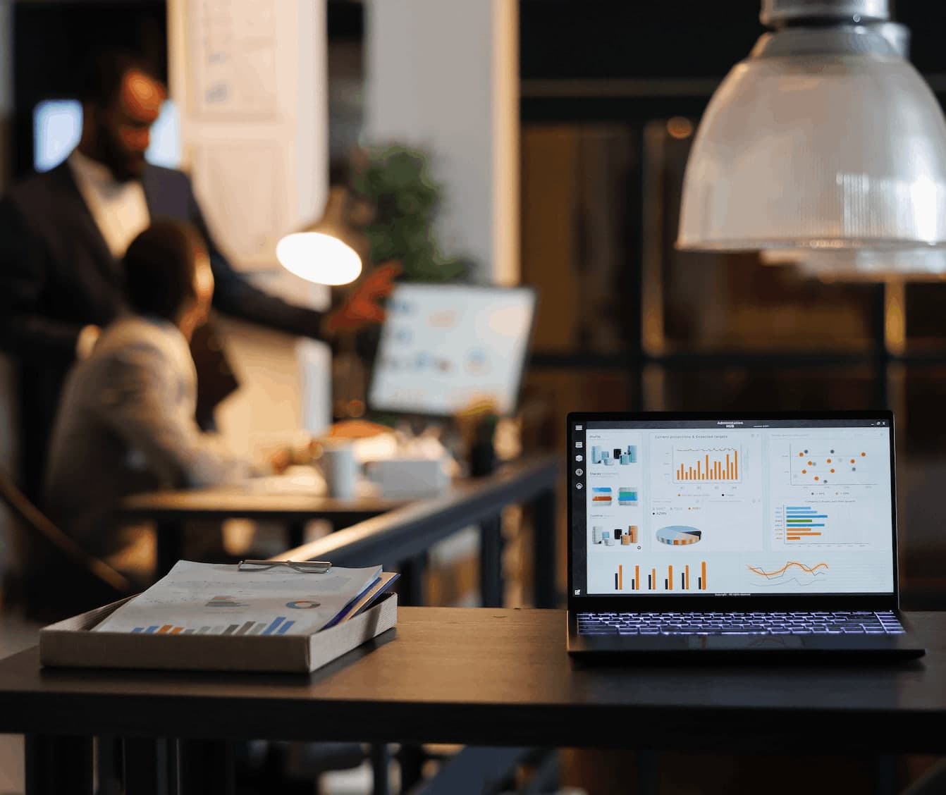 iGaming Marketing Lab agency review, analytics dashboard on a laptop in a modern strategy office