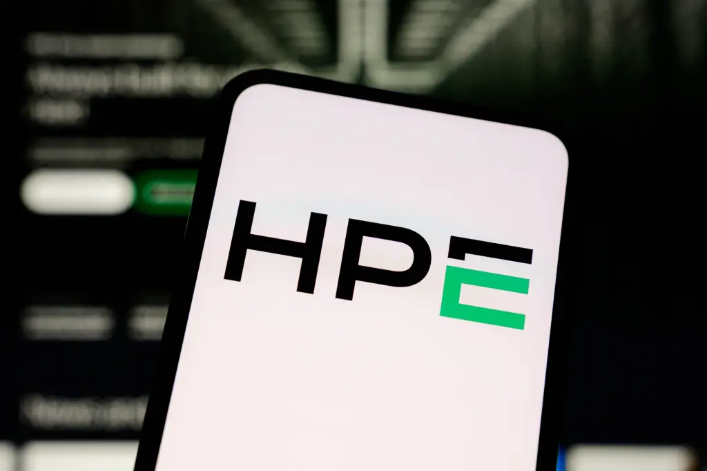 A smartphone displaying the HPE logo against a blurred data center background