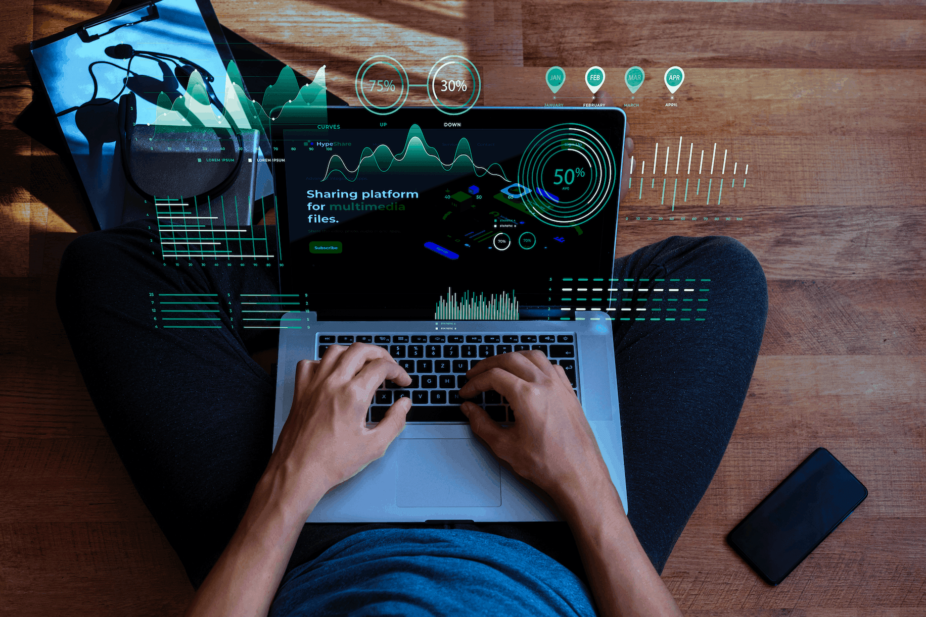 Overhead view of a person typing on a laptop surrounded by floating marketing analytics charts and metrics