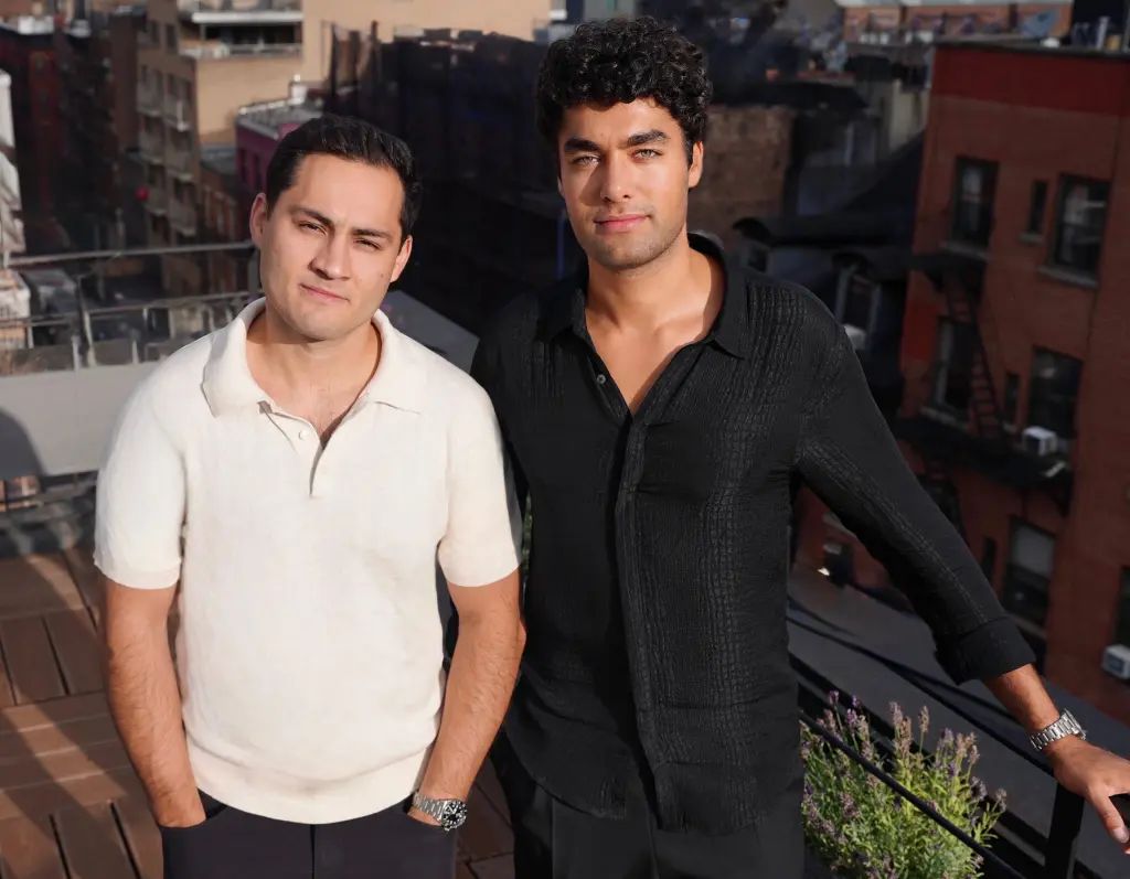 Mural cofounders Sinclair Toffa and Chris Fernandes standing on a rooftop